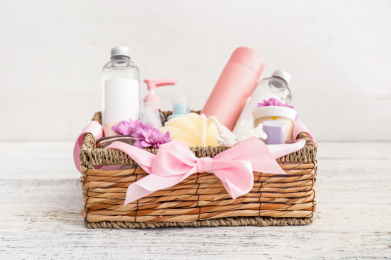 brown basket with self care products and pink bow