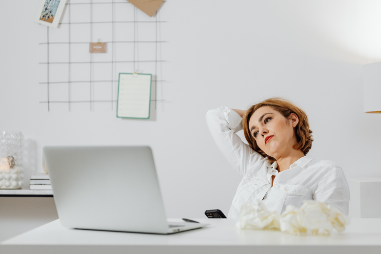 woman-sitting-at-desk-feeling-stressed